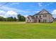 Charming two-story home with brick exterior and expansive green lawn at 3284 Hall Rd, Dacula, GA 30019