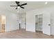 Bright bedroom has hardwood flooring, an open closet, and access to an ensuite bath at 3284 Hall Rd, Dacula, GA 30019