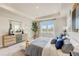Bright bedroom with large window, tray ceiling, and stylish modern furniture at 82 Sheryl Way, Loganville, GA 30052