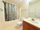 Cozy bathroom with a shower-tub combo, standard vanity, and tile flooring at 1047 Martin Heights Dr, Lawrenceville, GA 30044