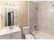Well-lit bathroom with a shower and tub combination, and a modern vanity at 6403 Charter Way, Lithonia, GA 30058