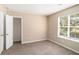 Cozy bedroom with carpet, closet and natural light offers a relaxing atmosphere at 6403 Charter Way, Lithonia, GA 30058