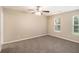 Spacious bedroom with large windows and a ceiling fan at 6403 Charter Way, Lithonia, GA 30058