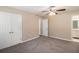 Spacious bedroom with large windows and a ceiling fan at 6403 Charter Way, Lithonia, GA 30058