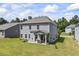 Spacious backyard featuring a covered patio and plenty of green space for outdoor activities at 2260 Cedar Place Ct, Snellville, GA 30078