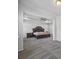 A primary bedroom featuring a ceiling fan, carpeted floors, and an elegant, oversized, wood-framed bed at 2260 Cedar Place Ct, Snellville, GA 30078