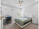 Cozy bedroom with a padded headboard, a desk, and soft carpeting, perfect for relaxation and productivity at 2260 Cedar Place Ct, Snellville, GA 30078