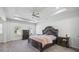 Elegant bedroom with a tray ceiling, a decorative headboard, and ample natural light at 2260 Cedar Place Ct, Snellville, GA 30078