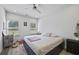 Inviting bedroom with natural light, ceiling fan, and neutral decor at 2260 Cedar Place Ct, Snellville, GA 30078