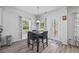 Dining area with natural light, wood floors, and access to outdoor patio at 2260 Cedar Place Ct, Snellville, GA 30078
