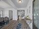 Inviting foyer with hardwood floors, elegant lighting, and a view of the staircase at 2260 Cedar Place Ct, Snellville, GA 30078