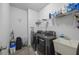 Functional laundry room featuring modern appliances, ample storage, and a utility sink at 2260 Cedar Place Ct, Snellville, GA 30078