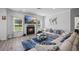 Cozy living room with fireplace and large windows providing natural light at 2260 Cedar Place Ct, Snellville, GA 30078
