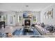 Bright living room with fireplace, large windows, and comfortable seating area at 2260 Cedar Place Ct, Snellville, GA 30078