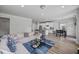 Large open concept living area with kitchen and dining area visible from the living room at 2260 Cedar Place Ct, Snellville, GA 30078