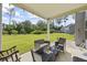 Relaxing outdoor patio with seating area overlooking a private backyard at 2260 Cedar Place Ct, Snellville, GA 30078