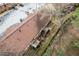Aerial view of building featuring the roof, back patios, and overgrown landscaping at 3187 Abbeywood Dr, Decatur, GA 30034