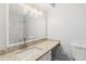 Bathroom featuring marble countertop, a modern sink and mirror, and tiled shower at 3187 Abbeywood Dr, Decatur, GA 30034