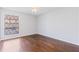 Bedroom with hardwood floors, ceiling fan, and window with partial view at 3187 Abbeywood Dr, Decatur, GA 30034