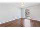 A bright bedroom showcasing hardwood floors and a window with blinds at 3187 Abbeywood Dr, Decatur, GA 30034
