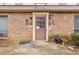Exterior entrance with a brick facade, traditional door, and unit numbers at 3187 Abbeywood Dr, Decatur, GA 30034