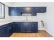 Kitchen featuring blue cabinets, granite countertops, and subway tile backsplash at 3187 Abbeywood Dr, Decatur, GA 30034
