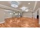 Basement with a kitchen, living area, hardwood floors, and recessed lighting at 866 Coopers Ridge Sw Path, Grayson, GA 30017