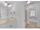 Bright bathroom featuring a vanity, mirror, and shower with a window seat at 866 Coopers Ridge Sw Path, Grayson, GA 30017