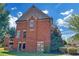 Rear exterior view of a brick house with landscaped yard at 866 Coopers Ridge Sw Path, Grayson, GA 30017