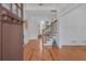 Elegant foyer with hardwood floors, white walls, and a staircase with ornate iron railings at 866 Coopers Ridge Sw Path, Grayson, GA 30017