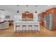 Elegant kitchen with island, seating, stainless appliances, and view of the living room at 866 Coopers Ridge Sw Path, Grayson, GA 30017