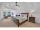 Spacious bedroom with a fireplace, bay window, tray ceiling, and neutral color scheme at 866 Coopers Ridge Sw Path, Grayson, GA 30017