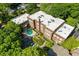 Aerial view showcases brick building with pool and verdant landscaping at 1041 State Nw St # 23, Atlanta, GA 30318