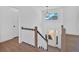 Bright entryway featuring staircase, wood flooring, and modern railing at 19 Bridgemill Dr, Douglasville, GA 30134