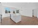 Modern kitchen with island with sink, stainless steel dishwasher, and hardwood flooring at 19 Bridgemill Dr, Douglasville, GA 30134