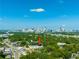 Stunning aerial view of property surrounded by lush trees, in a vibrant urban setting with city skyline at 175 Moreland Se Ave, Atlanta, GA 30316