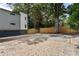 Gravel backyard with a mature tree and fence, offering a private outdoor space at 175 Moreland Se Ave, Atlanta, GA 30316
