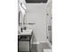 Modern bathroom features dual sinks, black hardware, and a glass-enclosed shower at 175 Moreland Se Ave, Atlanta, GA 30316
