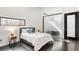 Modern bedroom with a comfortable bed, stylish side tables, and a sleek glass partition at 175 Moreland Se Ave, Atlanta, GA 30316