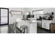 Modern kitchen with stainless steel appliances, white cabinetry, a center island, and sleek finishes at 175 Moreland Se Ave, Atlanta, GA 30316