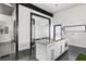 Modern kitchen with a large island, white cabinets, stainless appliances, and minimalist design at 175 Moreland Se Ave, Atlanta, GA 30316