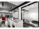 Open floor plan with a kitchen island leading to living and dining areas, showcasing modern design at 175 Moreland Se Ave, Atlanta, GA 30316