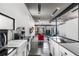 Bright, open concept living space showcasing the kitchen, dining, and living room with sleek modern design at 175 Moreland Se Ave, Atlanta, GA 30316