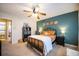 Cozy bedroom featuring a queen-sized bed, dark furniture, and stylish wall decor at 2232 Dunseath Ave # 407, Atlanta, GA 30318