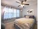 Charming bedroom with a full-sized bed, ceiling fan, and cozy decor at 2232 Dunseath Ave # 407, Atlanta, GA 30318