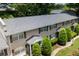 Well-maintained townhome exterior featuring lush landscaping and a new roof at 2232 Dunseath Ave # 407, Atlanta, GA 30318