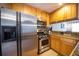 Bright kitchen featuring stainless steel appliances, wooden cabinets, and modern fixtures at 2232 Dunseath Ave # 407, Atlanta, GA 30318