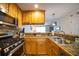 Well-equipped kitchen featuring stainless steel appliances, stone countertops, and ample cabinet space at 2232 Dunseath Ave # 407, Atlanta, GA 30318