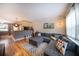 Inviting living room showcasing a comfortable gray sectional sofa, hardwood floors, and modern decor at 2232 Dunseath Ave # 407, Atlanta, GA 30318