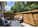 Cozy patio with a privacy fence, decorative string lights, and comfortable outdoor seating area at 2232 Dunseath Ave # 407, Atlanta, GA 30318